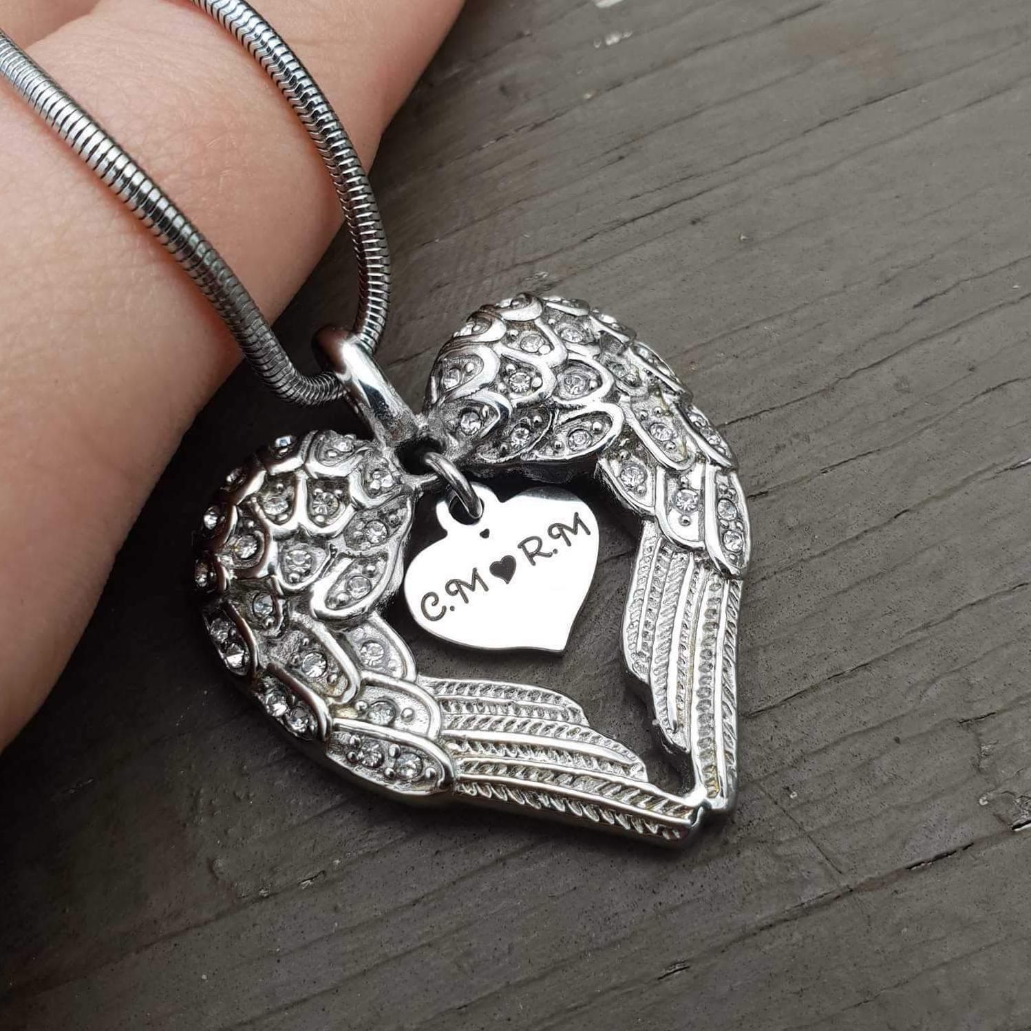 Heart locket deals with angel wings