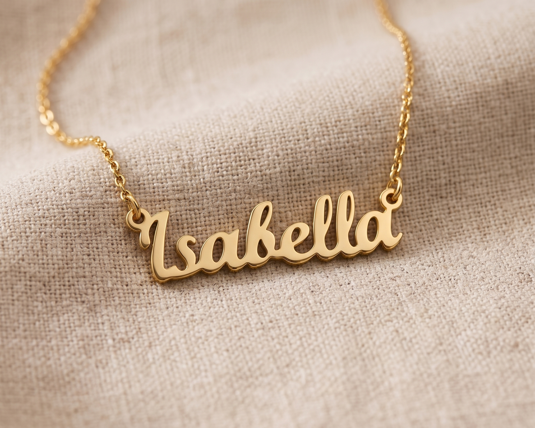 Layered necklaces at different lengths over a plain neutral top
