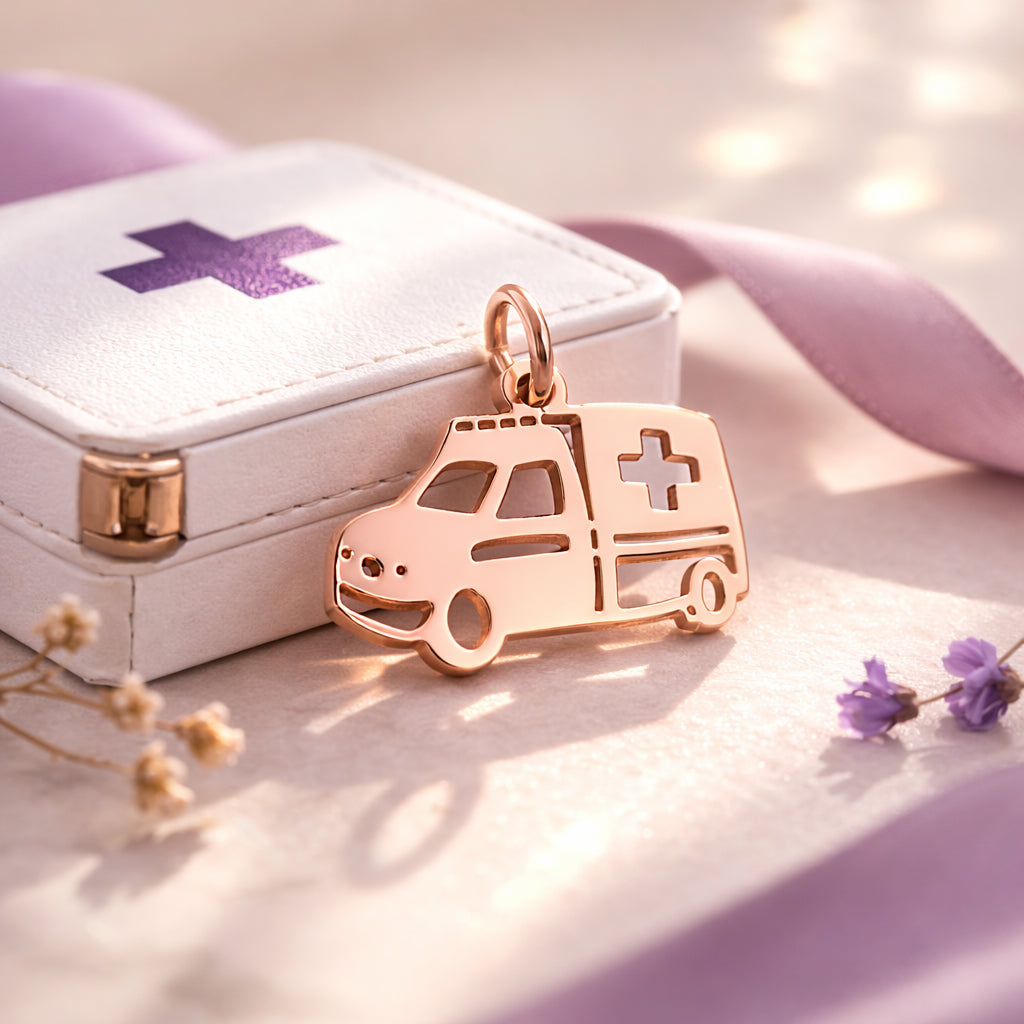 Belle Fever rose gold ambulance charm for keyring beside paramedic box, elegant healthcare appreciation gift.