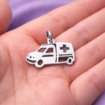 Belle Fever silver ambulance charm for keyring in palm, detailed paramedic vehicle charm nurse gift idea.