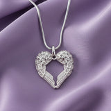 Belle Fever silver angel heart necklace, handcrafted symbolic jewellery representing love and protection,