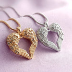 Belle Fever silver and rose gold angel heart necklace on purple fabric handcrafted symbolic jewellery representing love and protection, an elegant and thoughtful gift for her, handmade in Australia.