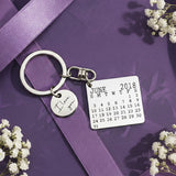 Belle Fever calendar keyring with disc charm, personalized with your custom date, a romantic anniversary and Valentine gift for couples.