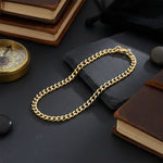 Gold curb chain bracelet, waterproof non-tarnish unisex jewelry displayed elegantly, timeless everyday statement chain.