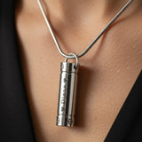 Belle Fever Cylinder Cremation Necklace worn close to the heart — a meaningful pendant that keeps loved ones’ memories alive forever.