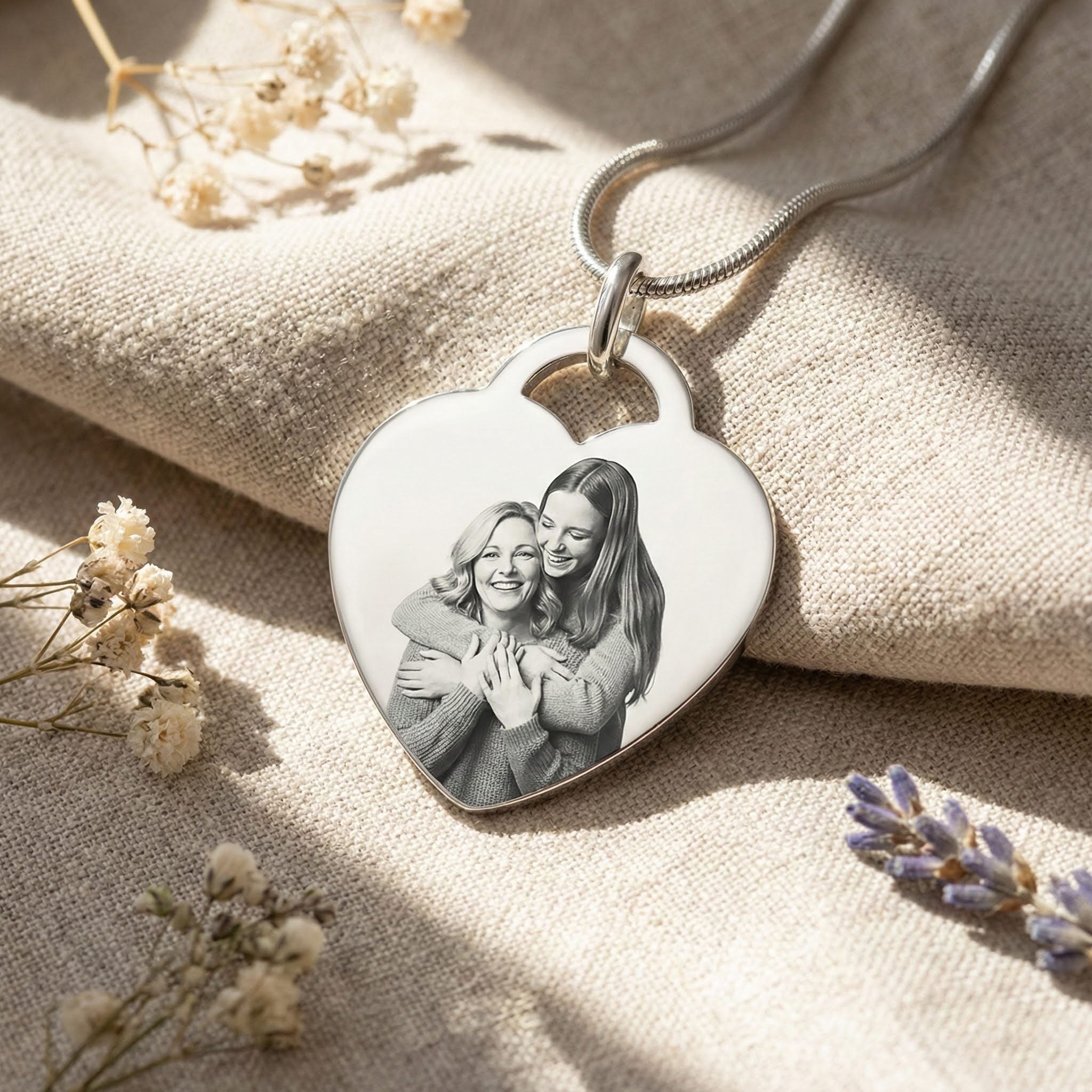 Belle Fever Forever in My Heart Photo Necklace — silver heart pendant engraved with a cherished photo, beautifully placed on soft linen with dried florals, celebrating love and treasured memories.