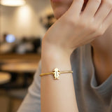 Belle Fever gold moment bracelet with girl charm bracelet on model, engraved name charm bracelet, sentimental keepsake gift for mom and grandma