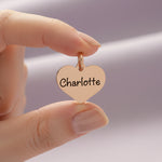 belle fever custom engraved heart keychain charm held in hand, personalized name keepsake gift full of meaning