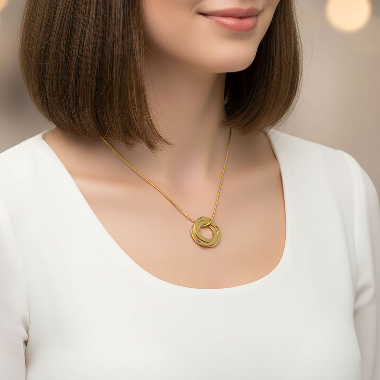 Interlinked Family Love Circles Necklace — gold personalised pendant worn with a white top, a timeless keepsake symbolising family love and togetherness.