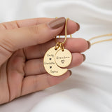 Belle Fever Moon and Back Necklace — gold round pendant held gently in hand, engraved with a loving message celebrating unbreakable bonds and cherished memories.
