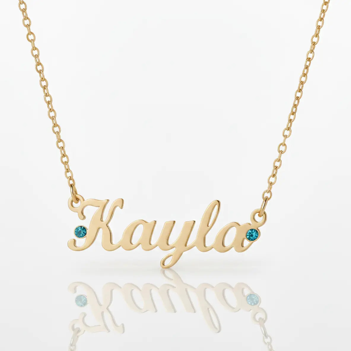 Gold Belle Fever Name Necklace with turquoise birthstones — a handcrafted keepsake symbolising love, beauty, and the joy of self-expression.