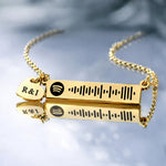 Gold personalized music bar necklace featuring an engraved song code and heart charm, Belle Fever design