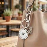 Personalized prints on my heart keyringhanging on bag with custom engraved paw and heart charms. belle fever remembrance gift for pet lovers.
