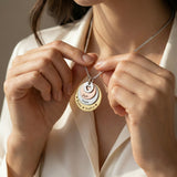 Belle Fever Tower of Love necklace worn by a model, showcasing the layered charm pendant design
