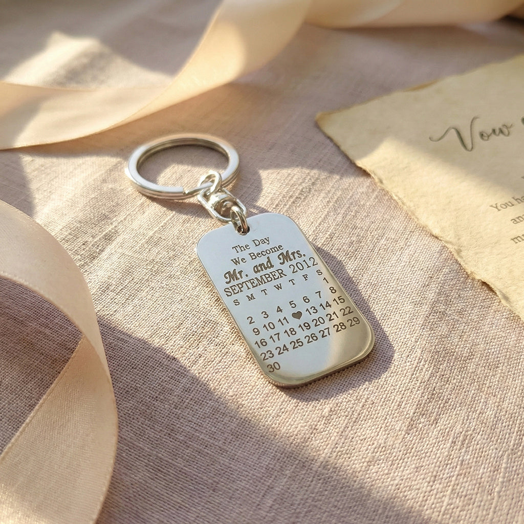 Double-sided personalized photo tag keyring featuring a photo on one side and engraved calendar on the other