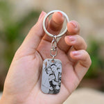 Hand holding a personalised photo tag keyring with custom engraved calendar date