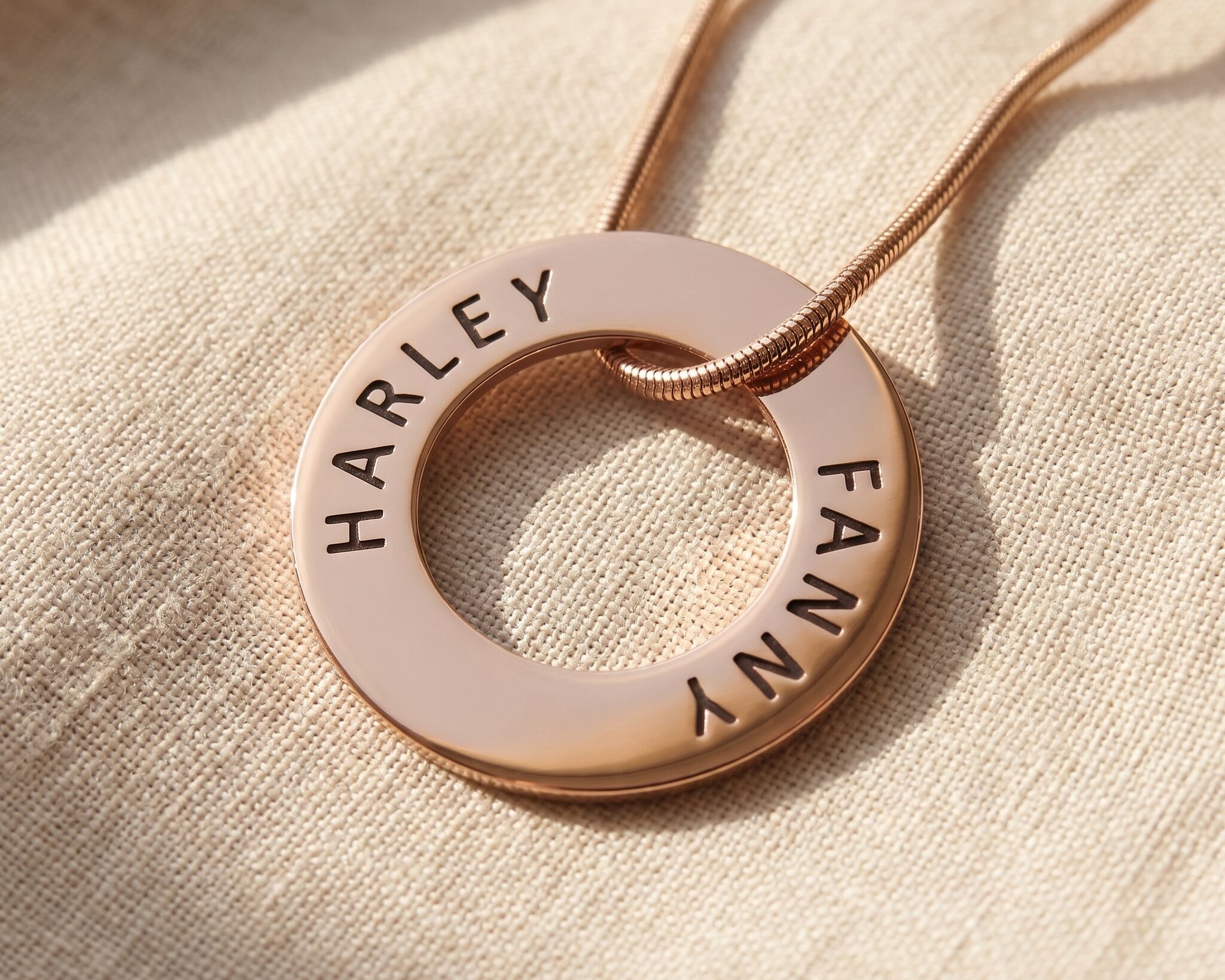 Always Forever necklace in gold with engraved names on circle pendant, refined personalised jewellery