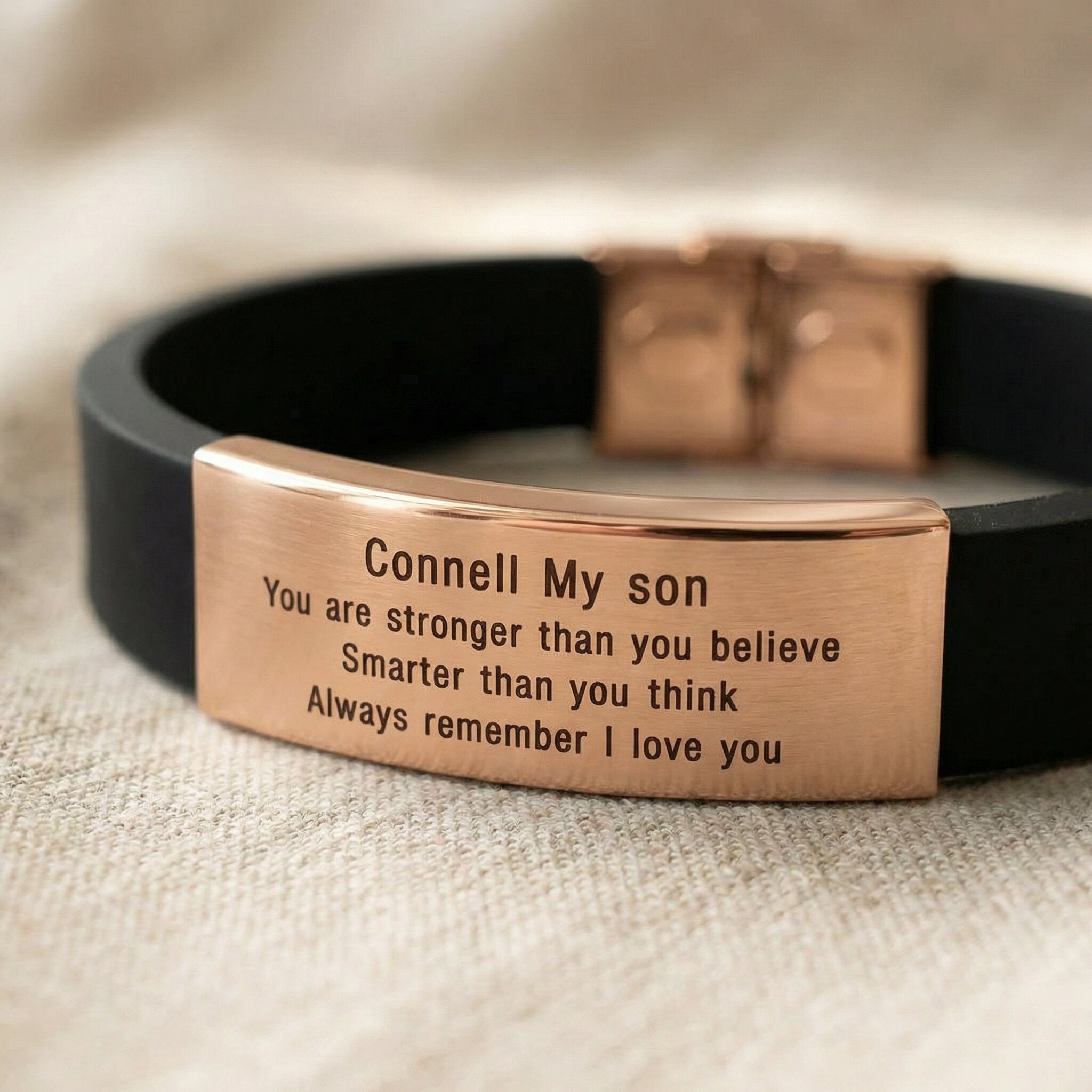 Close up of Always Remember personalised ID bracelet showing engraved message on metal plate