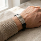 Man wearing Always Remember personalised ID bracelet with engraved plate on silicone band