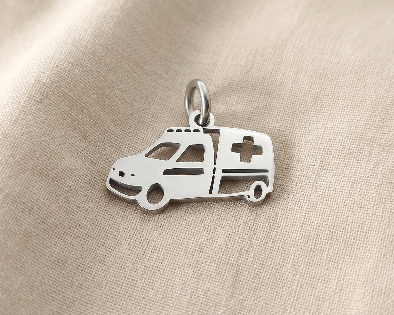 Silver ambulance charm for keyring honoring healthcare workers, emergency responders, and medical dedication