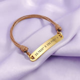Belle Fever bar cord bracelet in gold tone with custom engraved name or coordinates, adjustable personalised jewelry gift for her or him.
