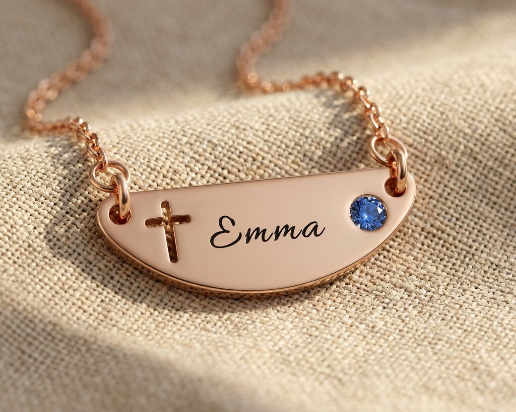 Beck name necklace showing cross design option with engraved name and birthstone detail