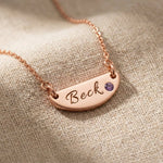 Rose gold Beck name necklace with engraved bar pendant and birthstone detail