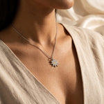 Woman wearing beginning necklace, elegant jewellery symbolising new chapter and personal growth
