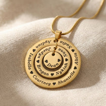 Gold Circle of Loved Ones necklace on delicate chain in neutral background 