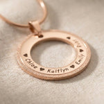 Circle of Trust Necklace personalized circle pendant showing engraved name and sparkling textured edge detail