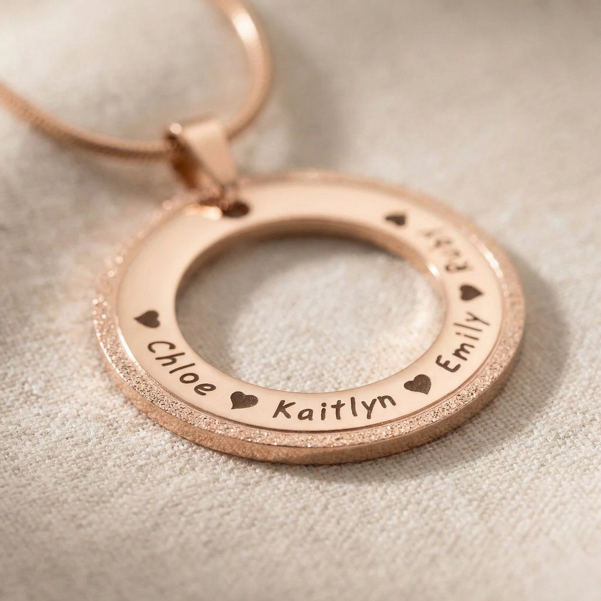 Circle of Trust Necklace personalized circle pendant showing engraved name and sparkling textured edge detail