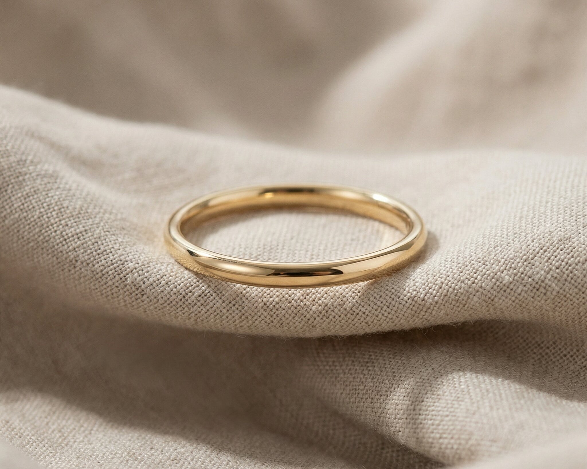 Classic band ring in gold with smooth finish, minimalist everyday jewellery hero image