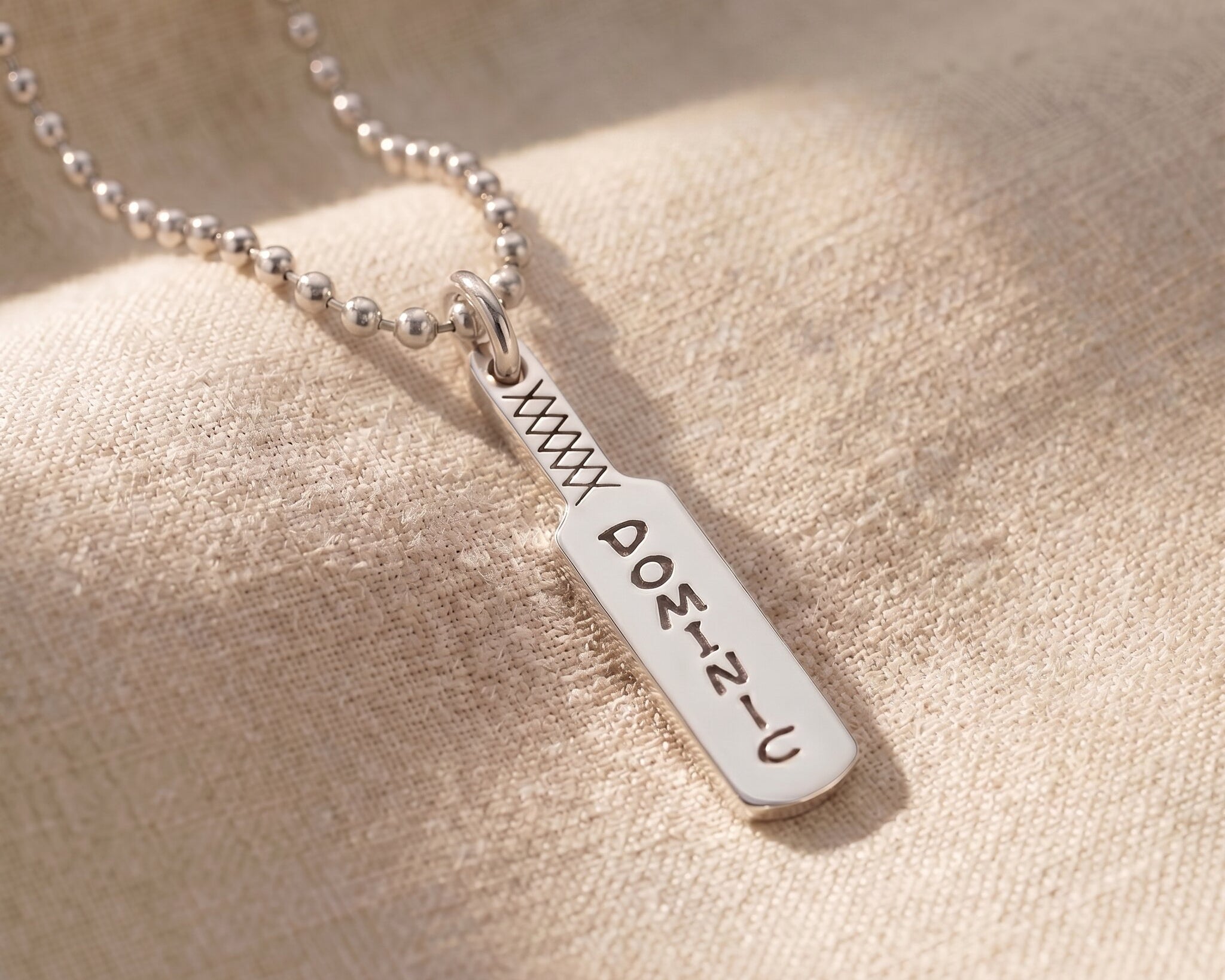 Cricket bat name necklace in silver with engraved name, personalised sporty jewellery design