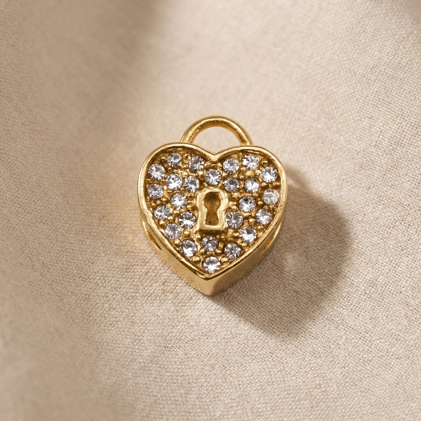 Gold heart lock charm with crystal accents for Moments Bracelet in romantic luxury jewelry style