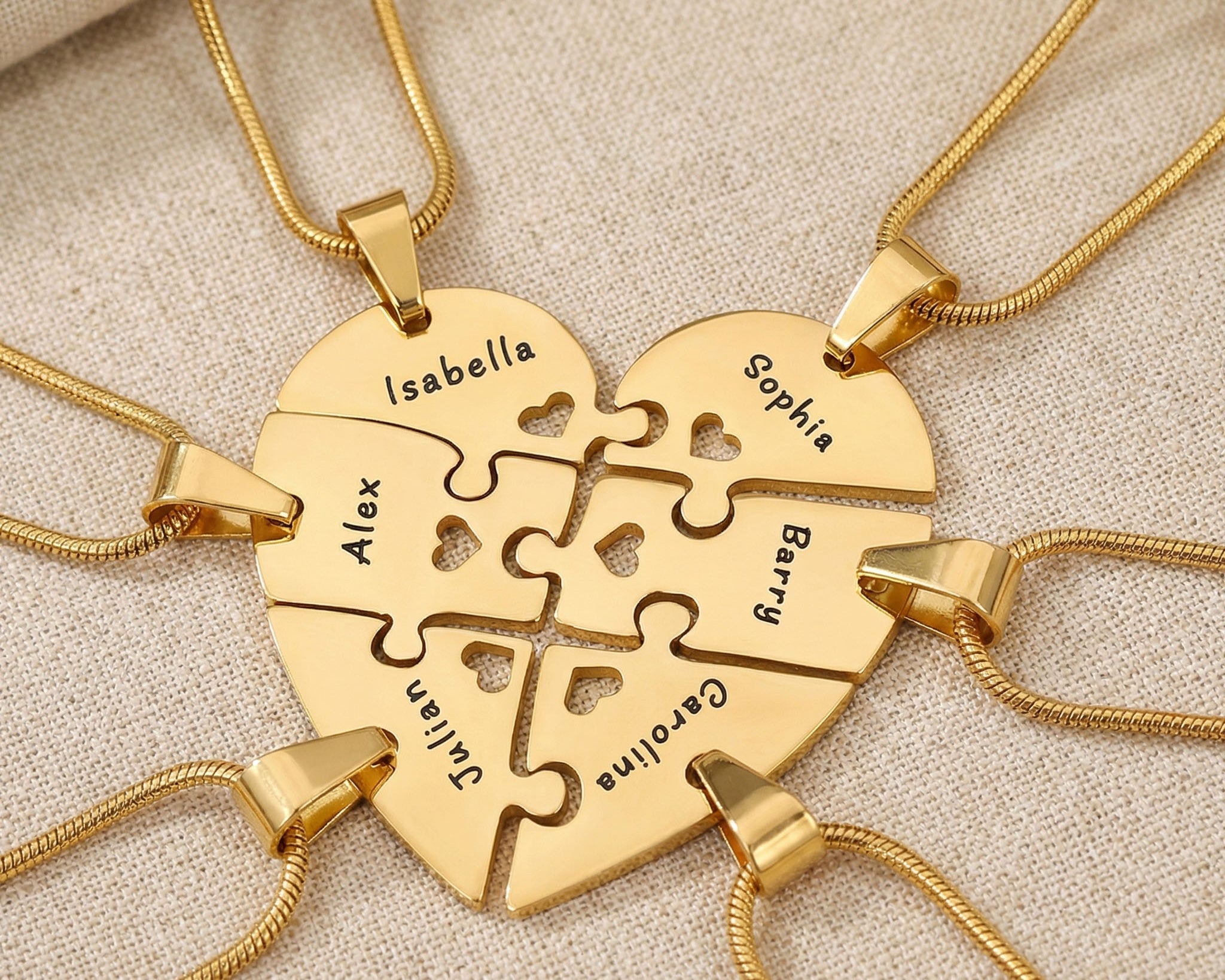 Heart Puzzle Necklace with six gold interlocking engraved pieces forming full heart