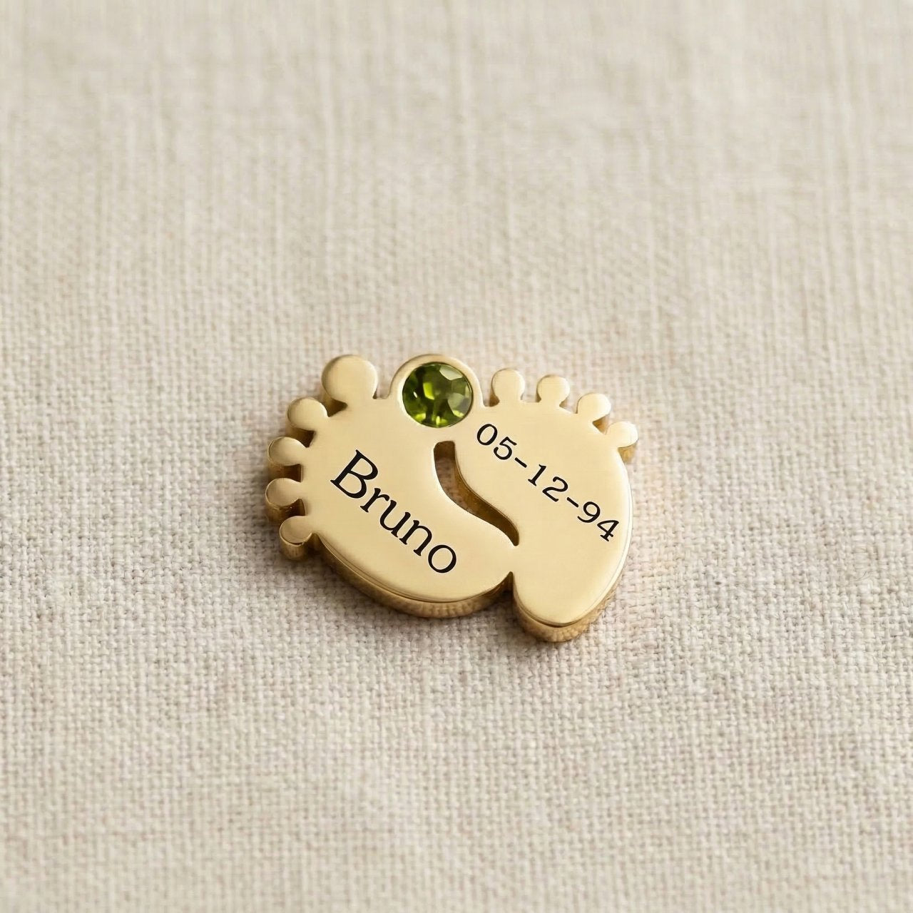 Gold baby feet birthstone charm for Dream Locket bracelet celebrating newborn milestones and family memories
