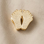 Gold baby feet charm for Moments Bracelet symbolizing motherhood, newborn memories, and family love