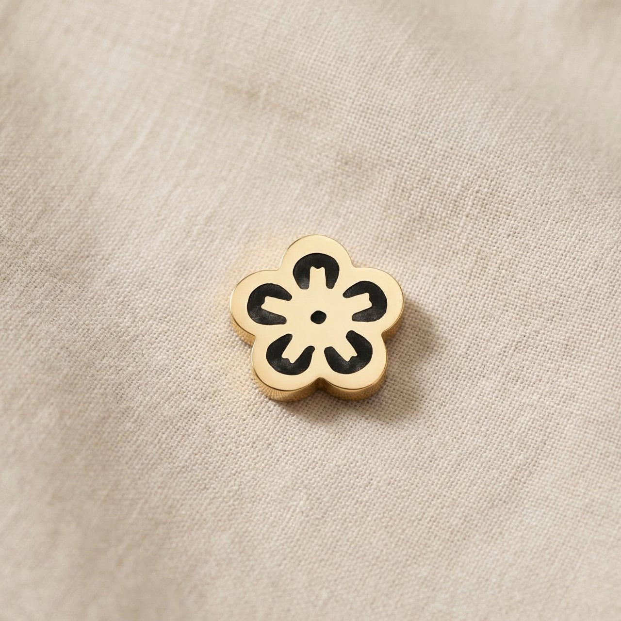 Gold flower charm for Dream Locket bracelet symbolizing beauty, growth, and meaningful life moments