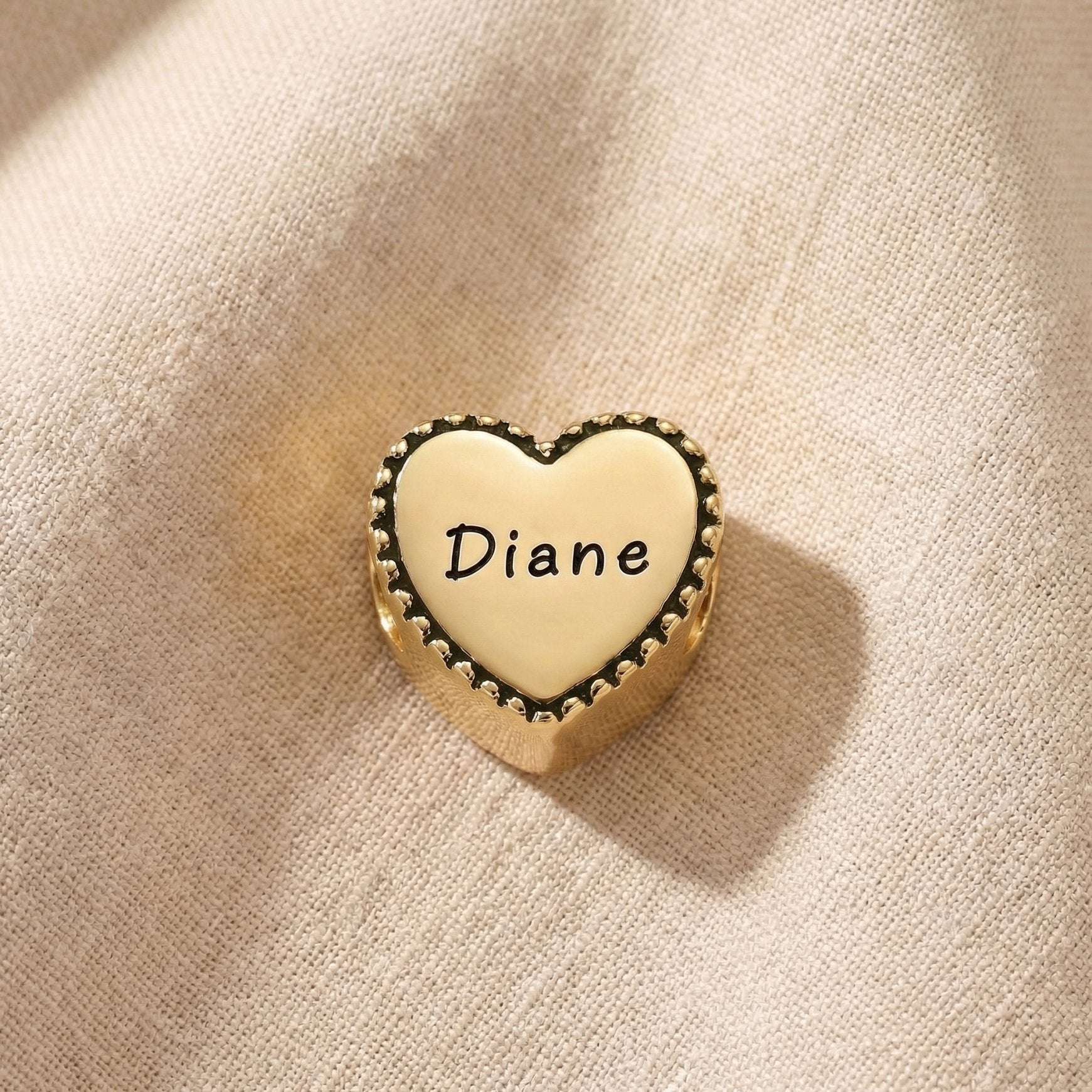 Personalized heart frame charm for Moments Bracelet with engraved name detail and vintage edging