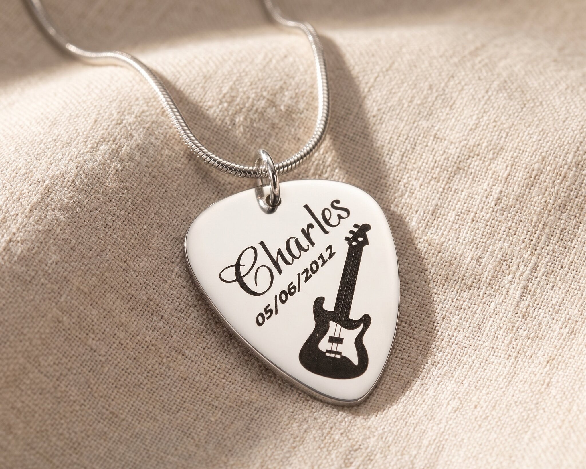 Guitar pick necklace in silver with engraved name, personalised jewellery for music lovers