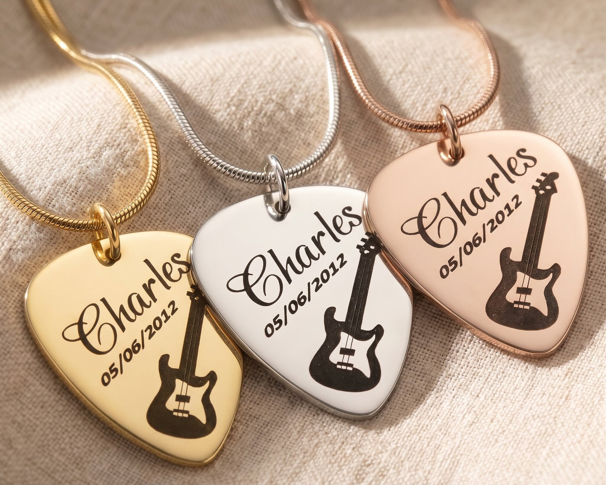 Guitar pick name necklace tone comparison showing gold, silver and rose gold finishes