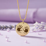 Hand on My Heart Necklace by Belle Fever —  engraved handprint pendant styled with lavender tones, a heartfelt memorial necklace keeping loved ones close