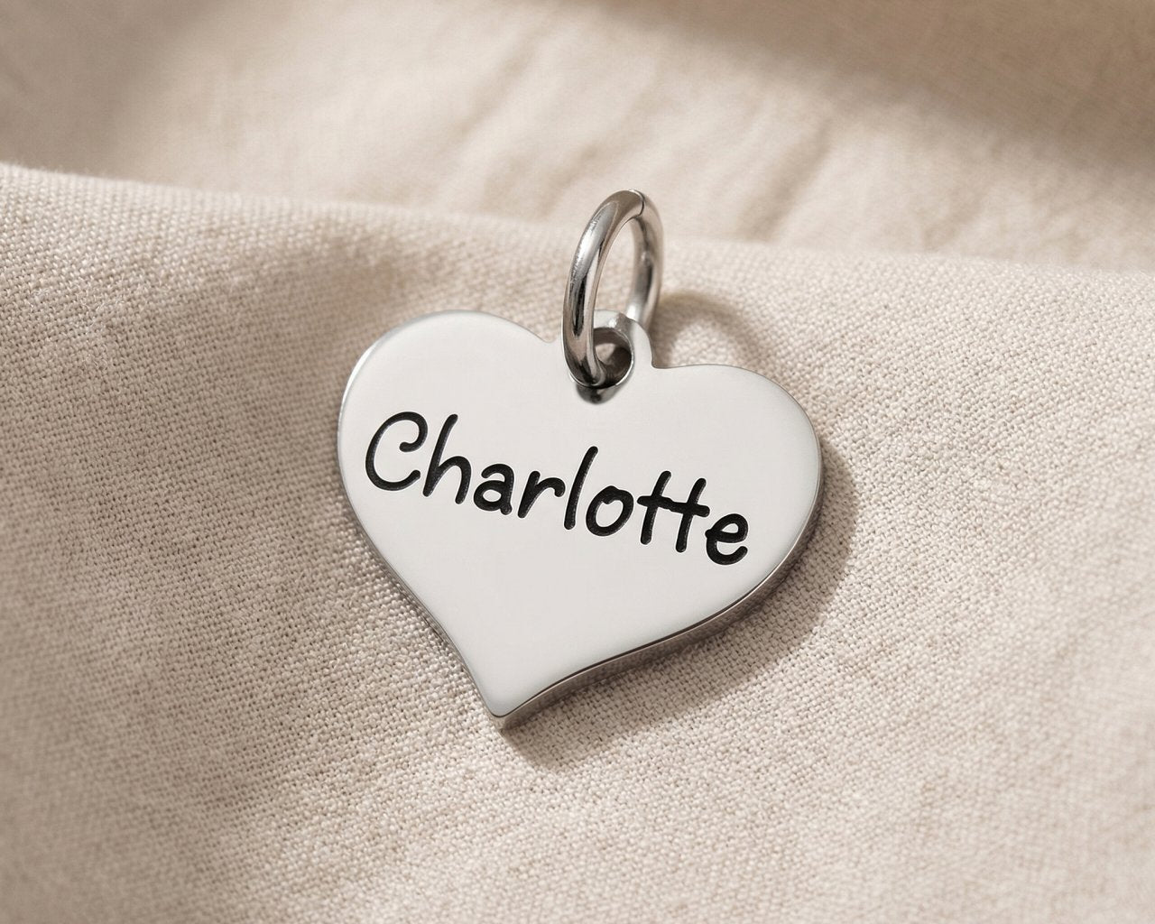 Personalized heart charm for keyring with custom engraved name symbolizing love, connection, and memories