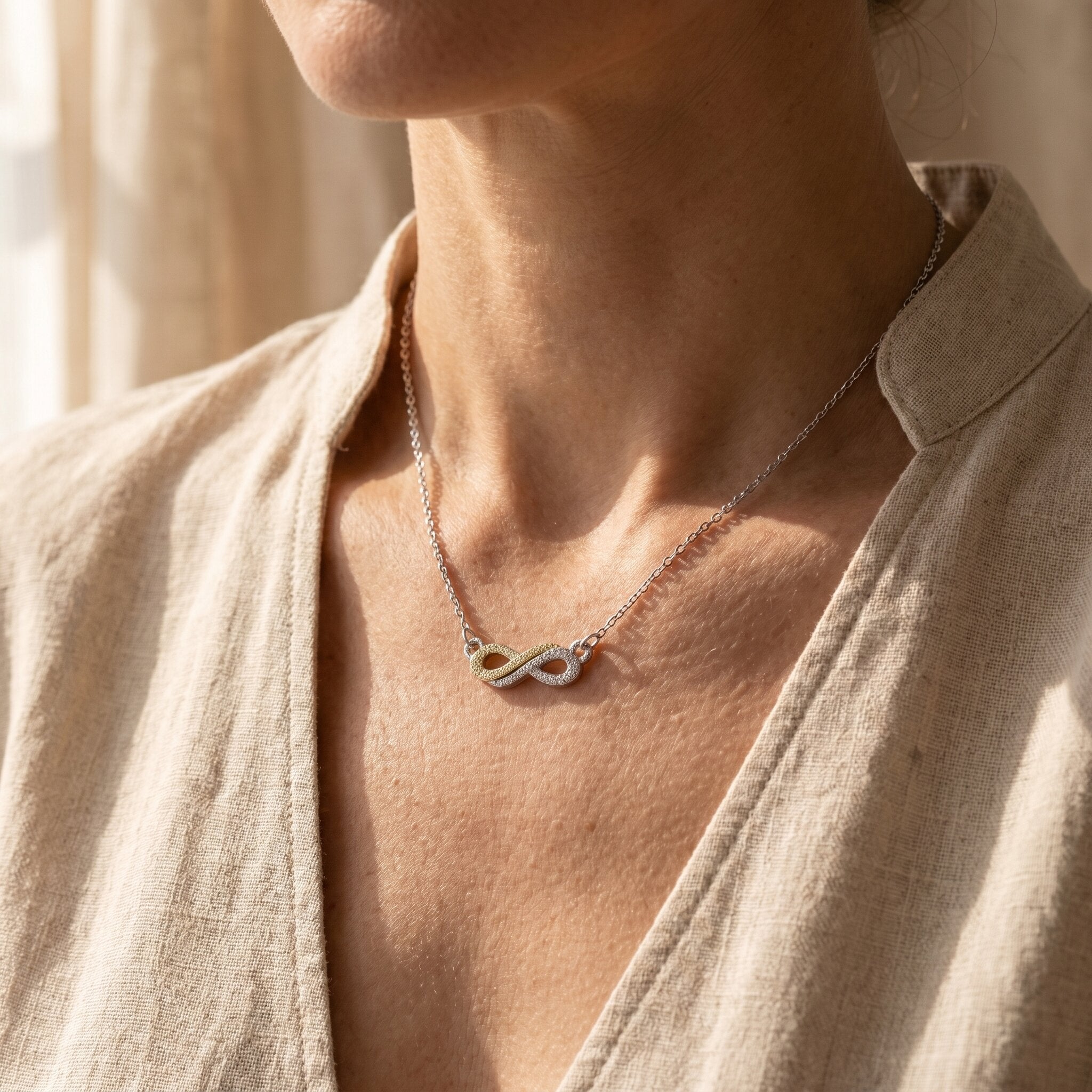 Woman wearing highs and lows necklace, symbolic jewellery representing life journey and connection