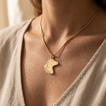 Woman wearing horse head name necklace with engraved detail, personalised equestrian jewellery