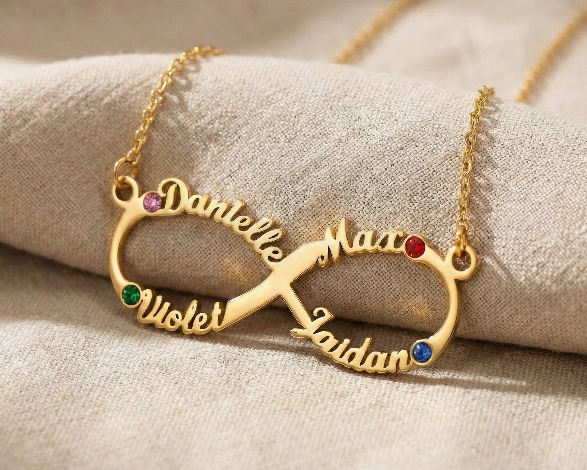 Infinity name necklace showing custom name and birthstone options on infinity design