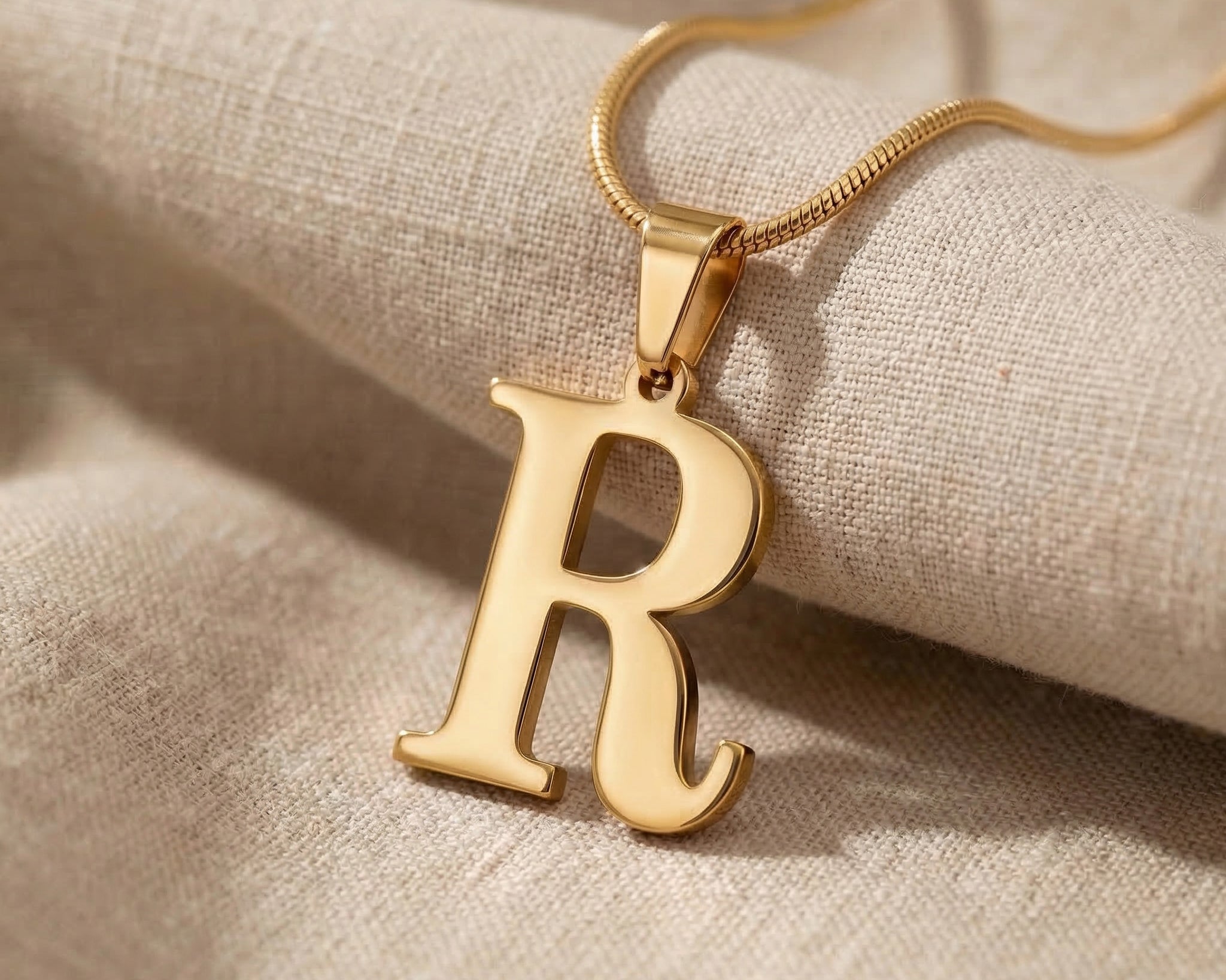 Initial Necklace in gold with letter pendant, personalised jewellery hero image