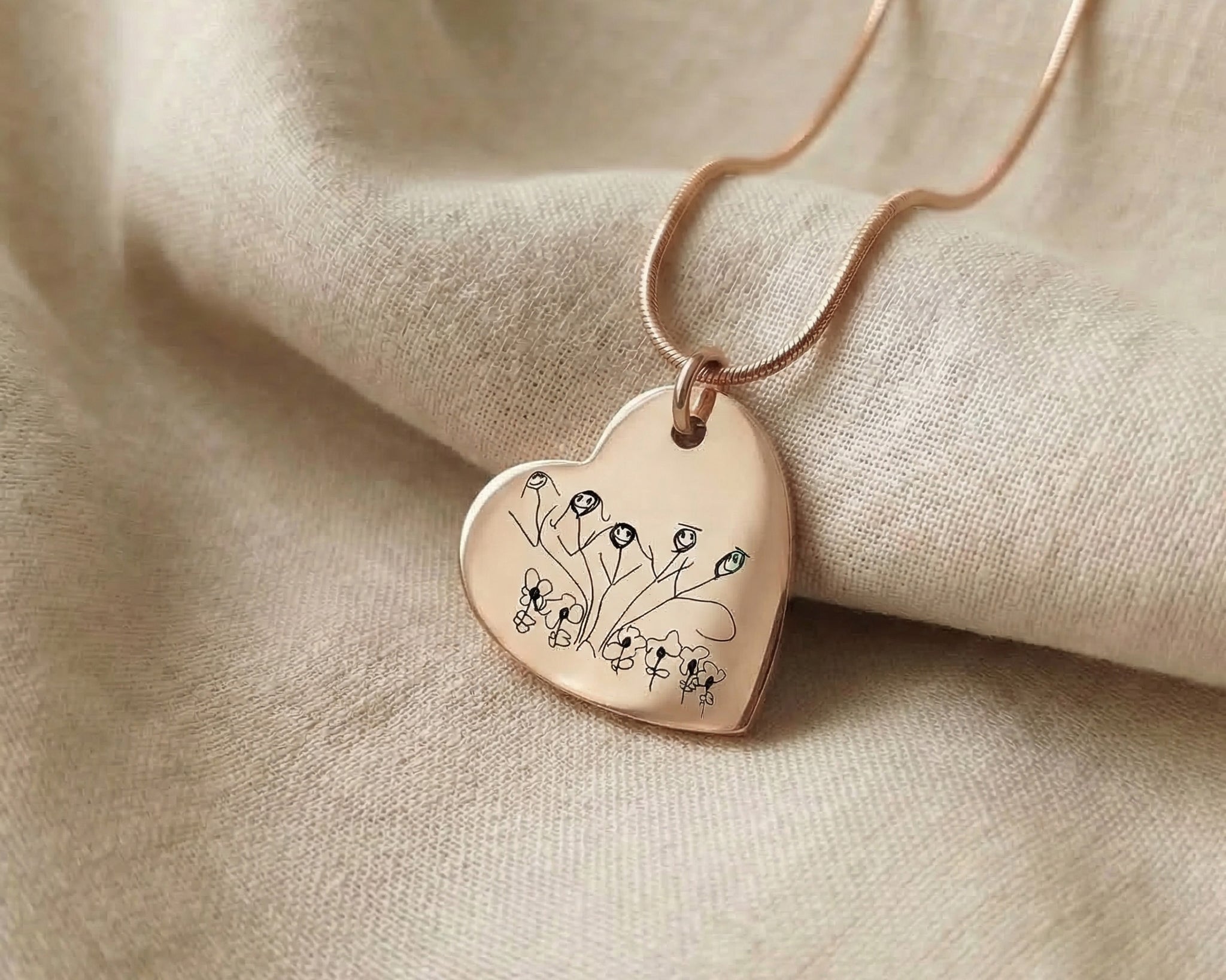 Kids drawing necklace showing heart shape pendant option with custom engraved artwork