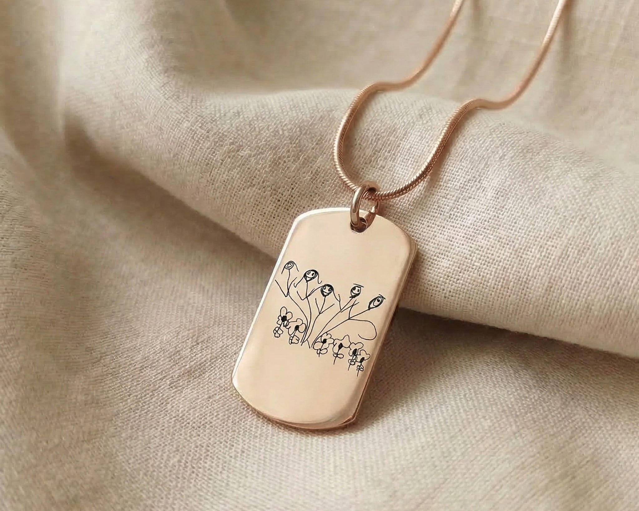 Kids drawing necklace showing dog tag style pendant option with engraved artwork