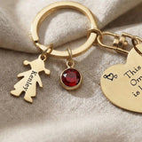 Close-up of Kids Love Heart Keyring showing engraved heart disc and charm with fine detail